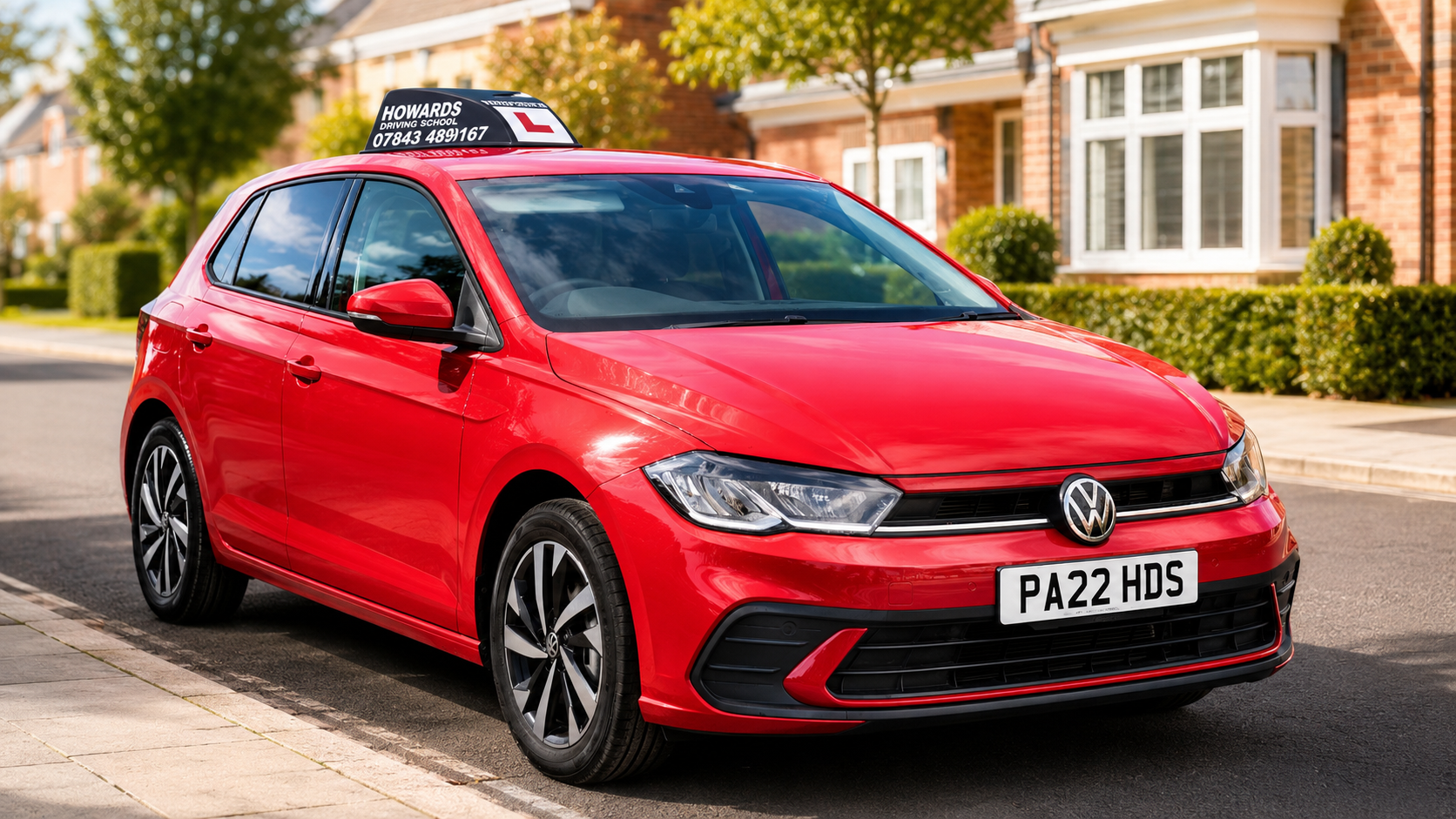 Howard's Driving School 2026 VW Polo with branded roof topper, parked in Buckingham